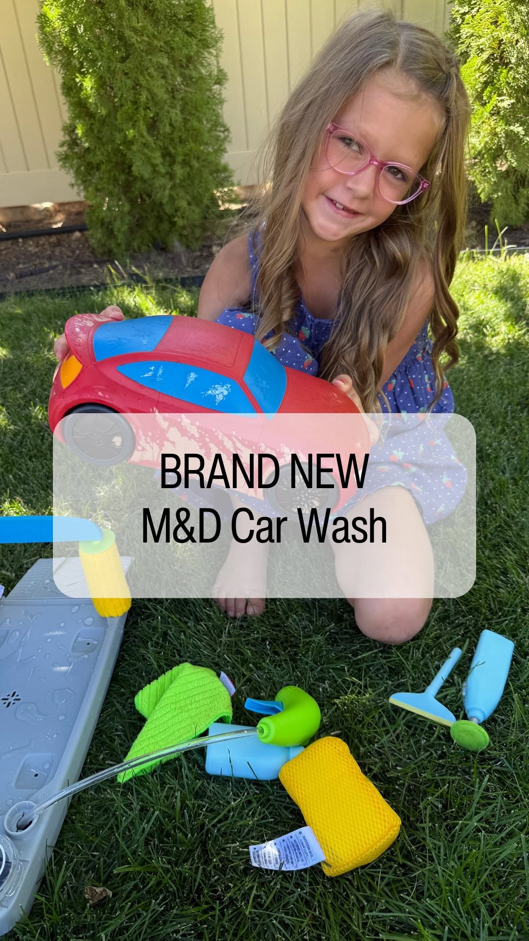 Instagram post by @toytestingsisters for Melissa & Doug. Caption reads: Shiny new arrival! ✨ The Spray & Shine Car Wash is....