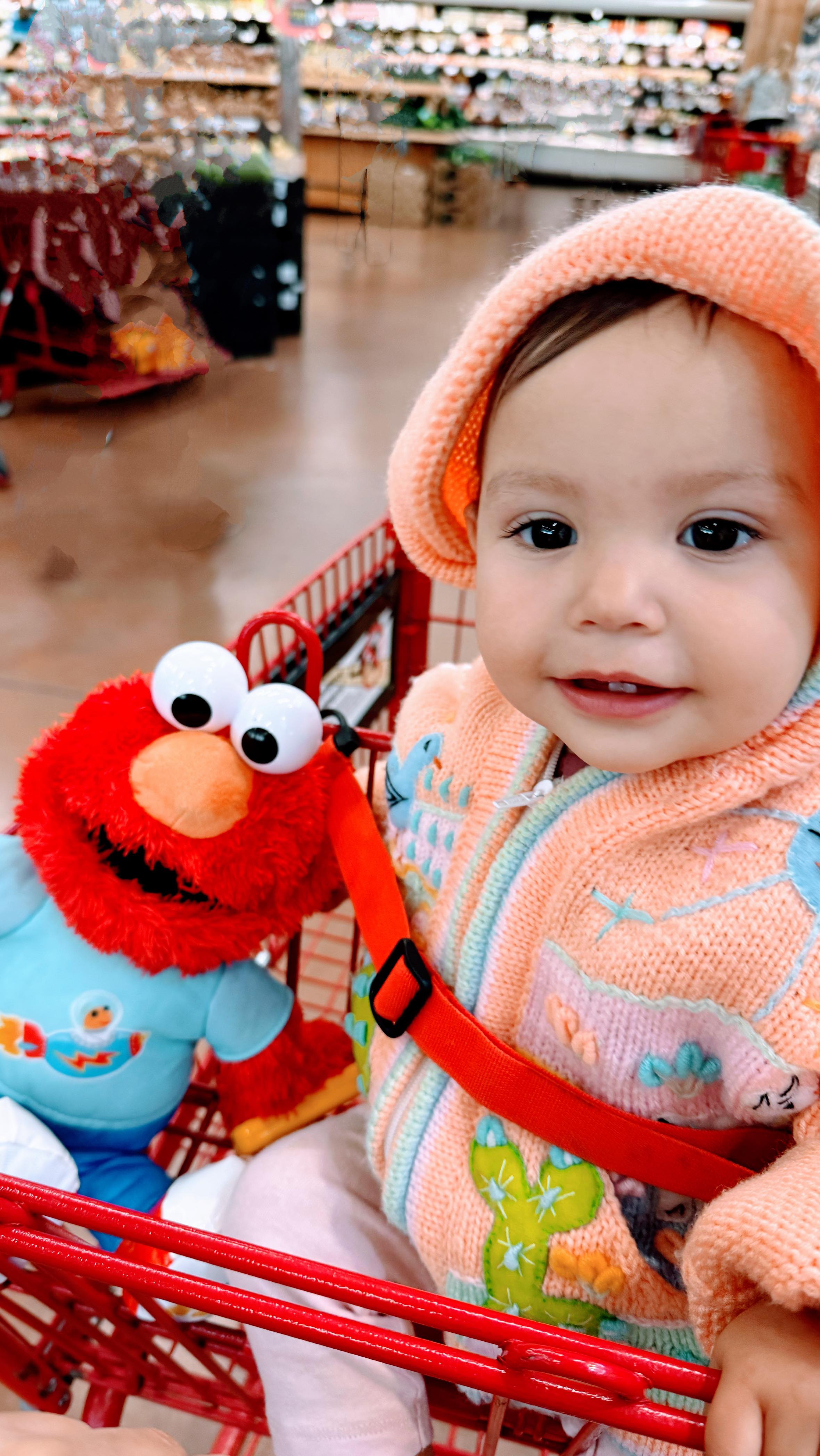 Instagram post by @ocjackieo for Just Play. Caption reads: We love to bring along our #LearningElmo where....