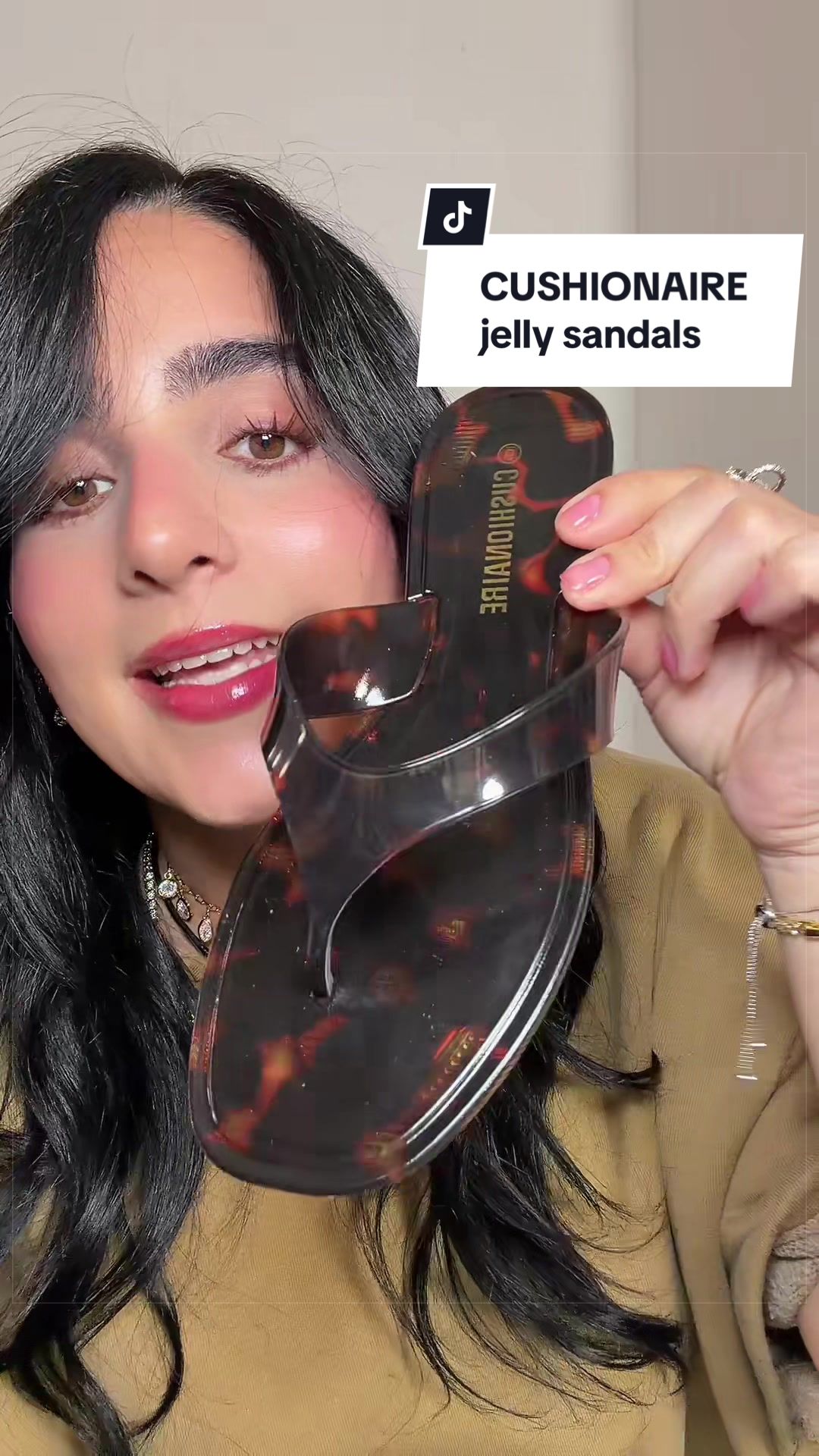 TikTok post by @sharyrivas_ for Cushionaire. Caption reads: CUSHIONAIRE jelly sandals #sandals #sandalias....