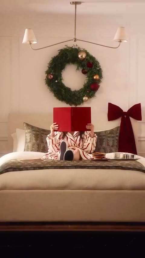 Instagram post by @chloejg for West Elm. Caption reads: This Christmas, I’m doing what I do best — in bed,....
