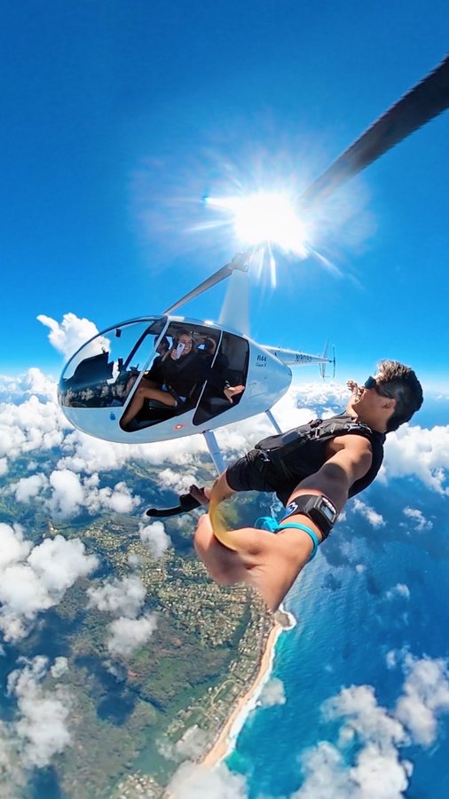 Instagram post by @eric.sierra for Shady Rays. Caption reads: Happy Valentine’s Day 🤍 • • #skydive #hawaii....