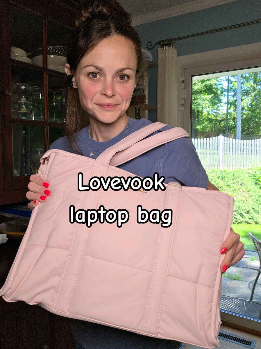 TikTok post by @caroline.3515 for Lovevook. Caption reads: [...] in love with this large laptop bag by....
