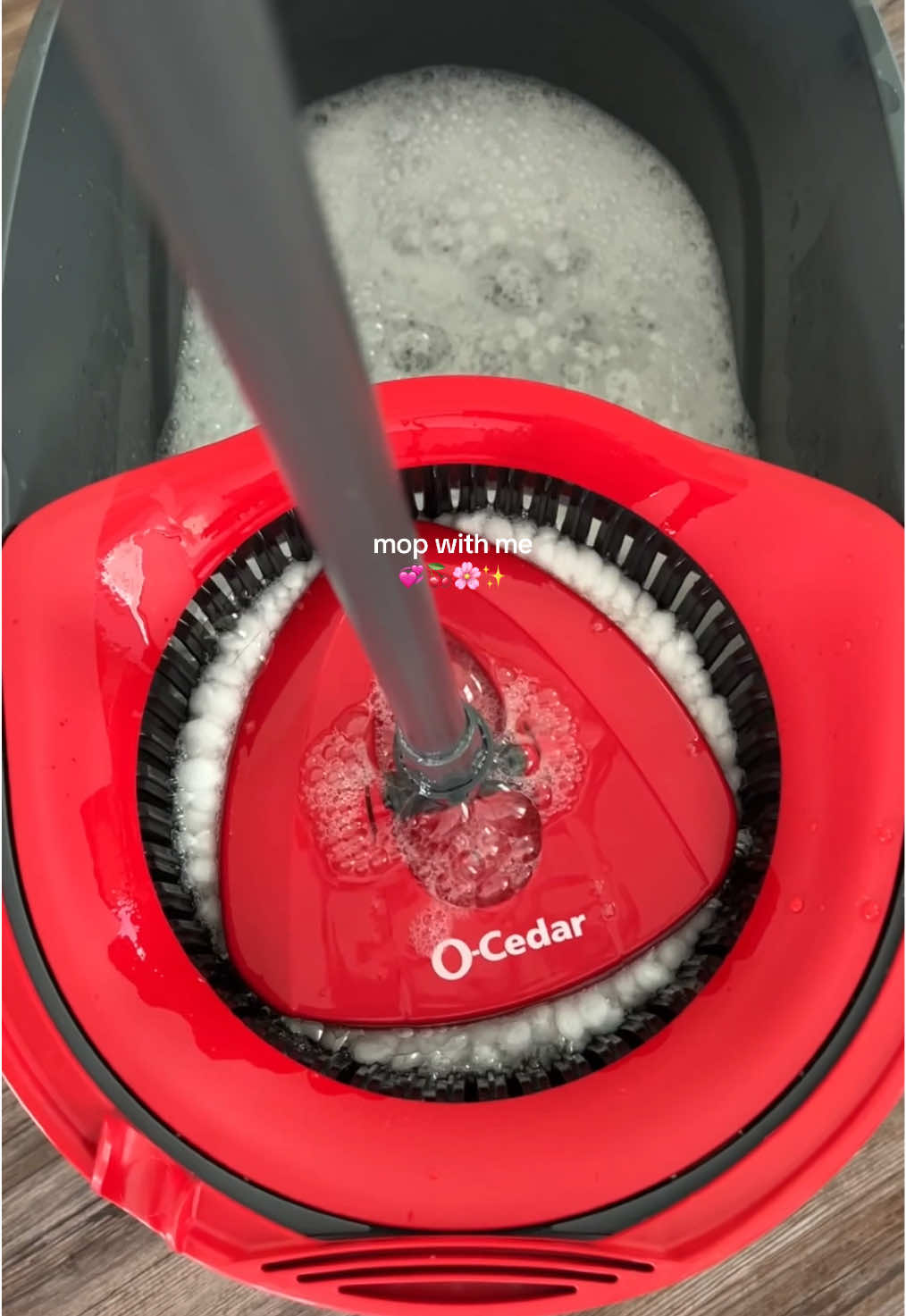 TikTok post by @brittany_qz for O-Cedar. Caption reads: mop with me using the @O-Cedar EasyWring spin mop,....