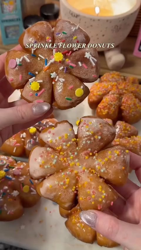 Instagram post by @lauras__bakery__ for Fancy Sprinkles. Caption reads: [...] in the prettiest sprinkles 🌼✨ Get Fancy....