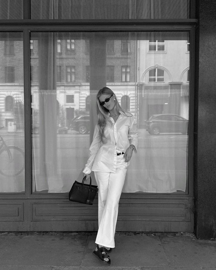 Instagram post by @victoriagarber for ANINE BING. Caption reads: Ad | White fits for spring 🤍.