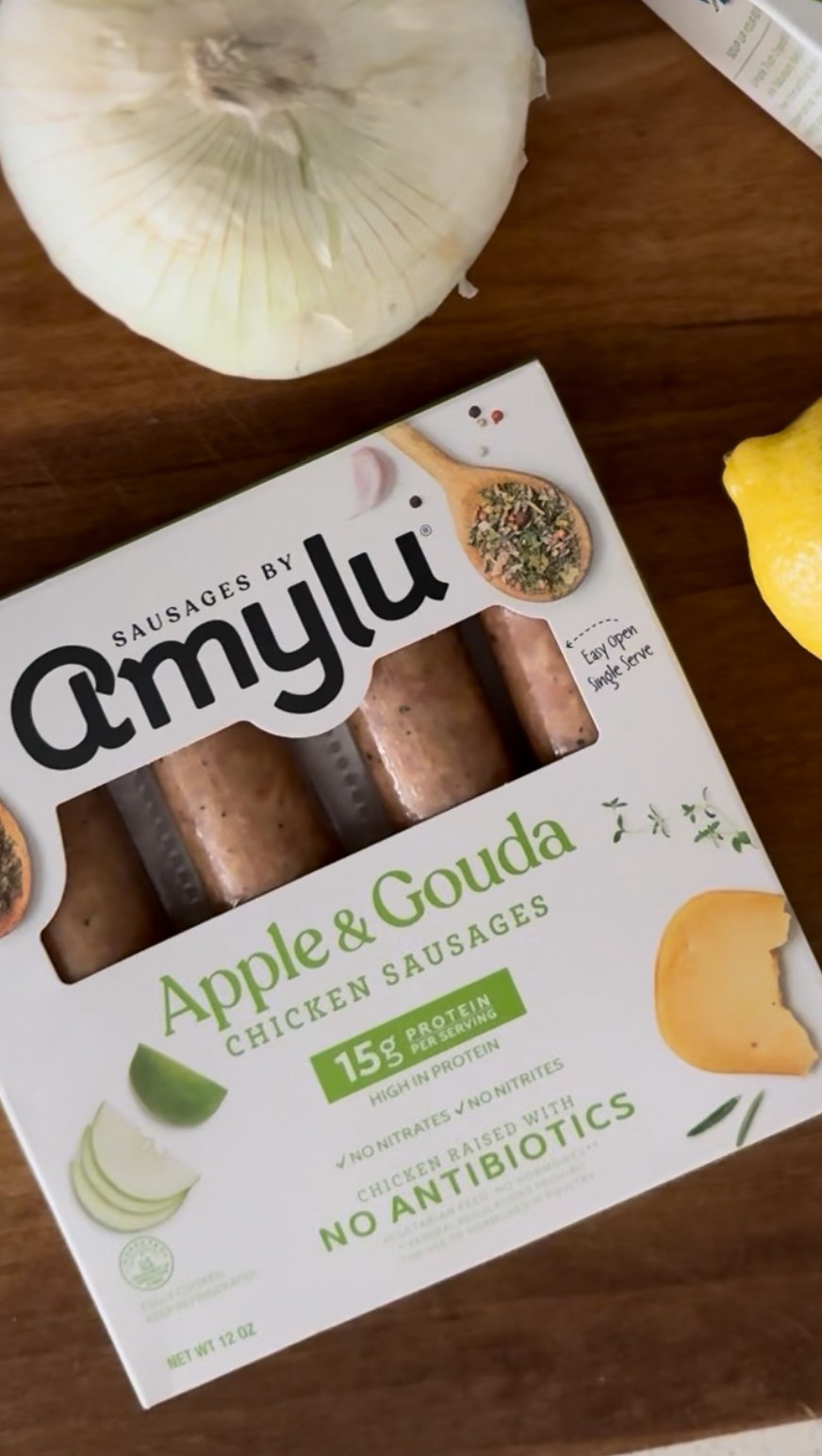 Instagram post by @aubreycuevas_ for Amylu Foods. Caption reads: Make Amylu Food Apple & Gouda chicken sausage with....