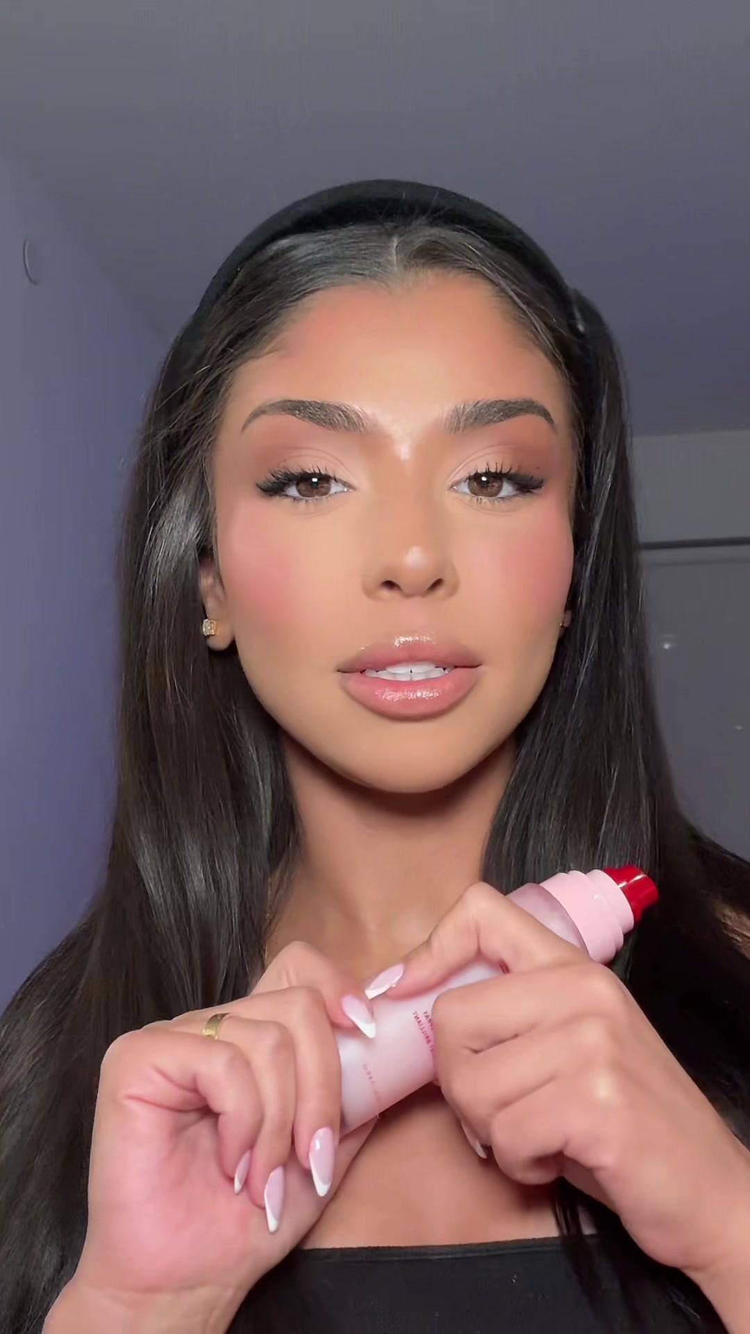 TikTok post by @haj.png for ONE SIZE BEAUTY. Caption reads: @ONE SIZE BEAUTY powder melt glass setting spray....