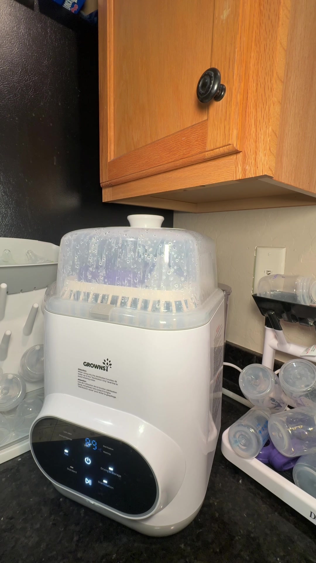 TikTok post by @drecorona for GROWNSY. Caption reads: The best investment! #grownsy #grownsybottlewasher....