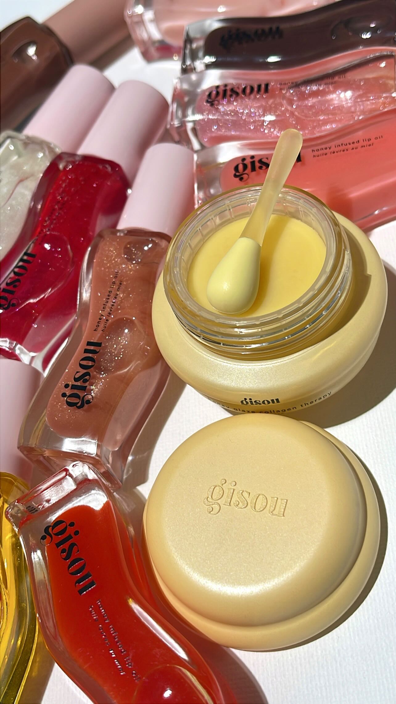 Instagram post by @leslovesbeauty for Gisou. Caption reads: 🍯🧈 Launching 11/14: @gisou Honey Glaze Collagen....