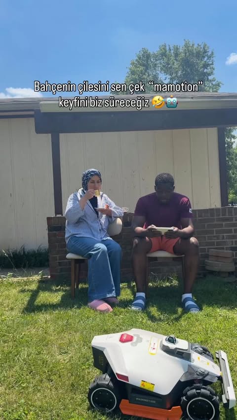 Instagram post by @2kita1aile for Mammotion Tech. Caption reads: #ad @mammotiontech is mowing, we’re relaxing. ☀️🍹....