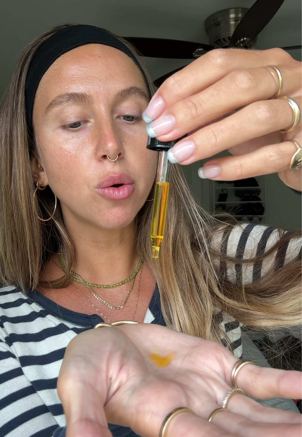 TikTok post by @caitregan for Cosmette Skincare. Caption reads: [...] look! rose garden renewal oil @Cosmette....