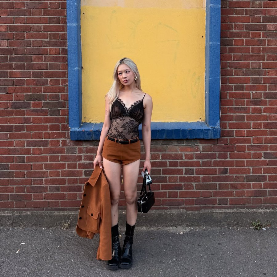 Instagram post by @nuriamaa for SELF-PORTRAIT. Caption reads: 🖤🩷.