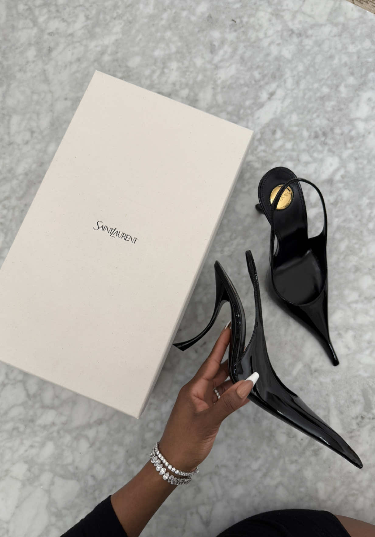 TikTok post by @jackieaina for Saint Laurent. Caption reads: @SAINT LAURENT this was so disrespectful #ysl....