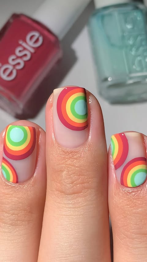 Instagram post by @abe.nailbabe for essie. Caption reads: 🌈Would you wear this?👀 #essiepartner ➡️I’m using....