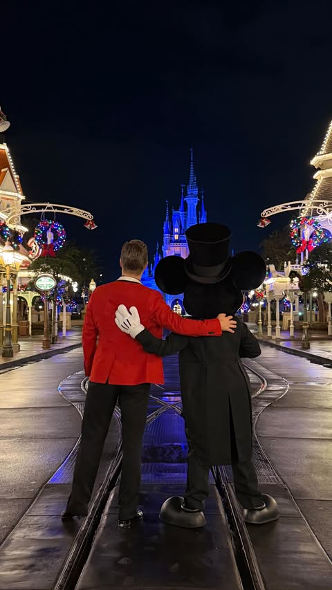 Instagram post by @derekhough for Disneyland. Caption reads: Holiday spirit officially activated. 🎁🎄

Come....