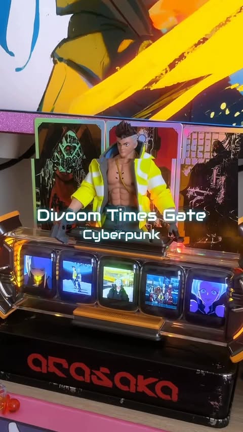 Instagram post by @madmotchi.zip for Divoom. Caption reads: Divoom times gate in yellow is so cyberpunk [...].