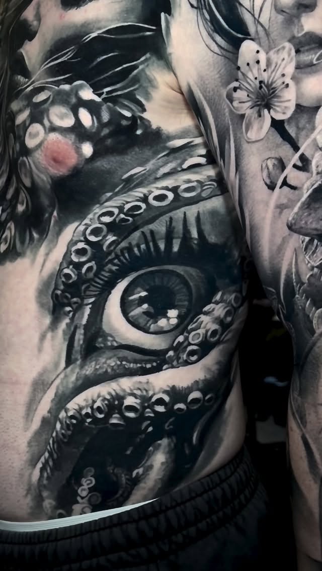 Instagram post by @domantasparvainis for World Famous Tattoo Ink. Caption reads: All healed. Awesome work on the left arm is not....