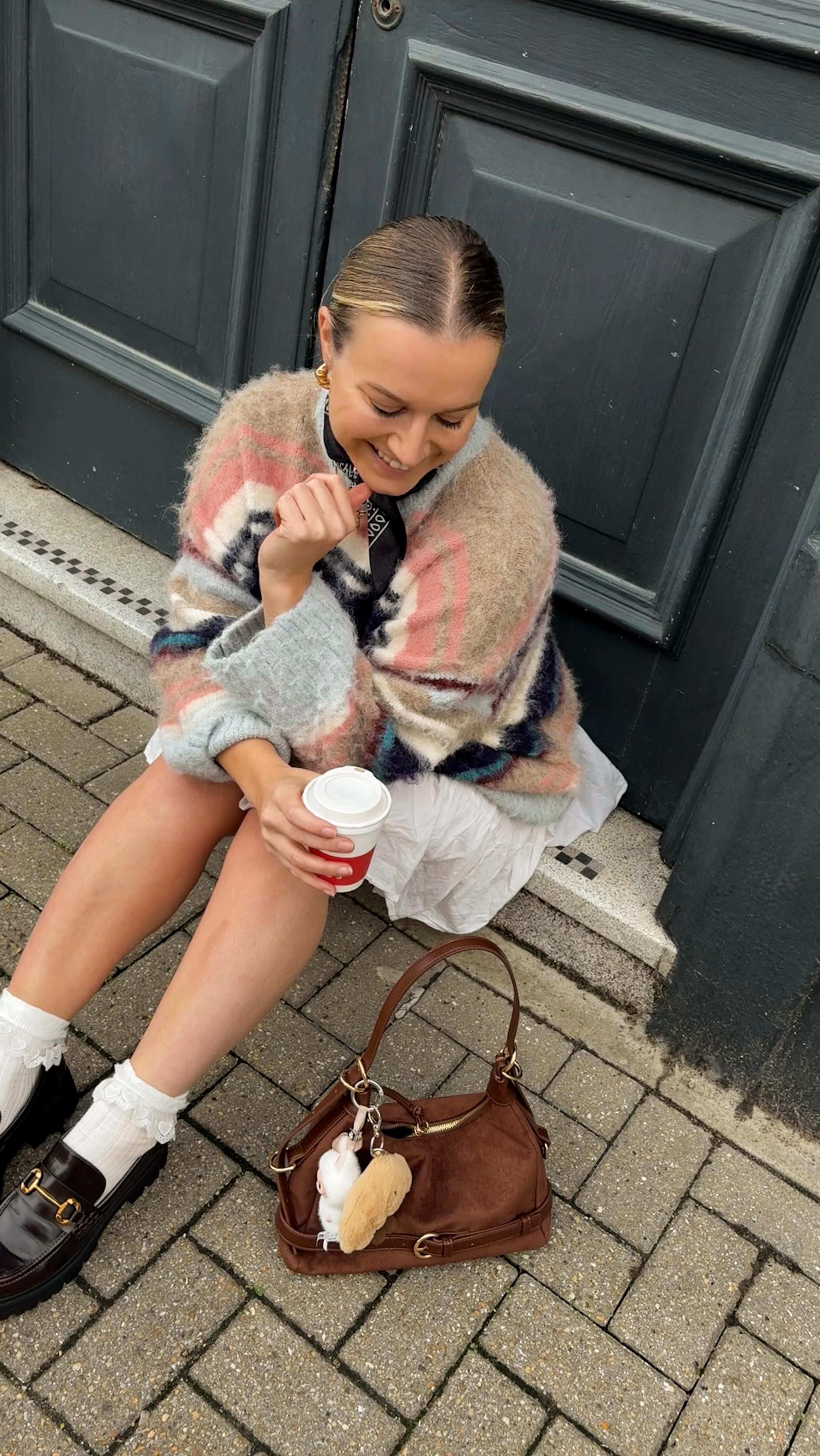 Instagram post by @hannahfgale for Deichmann. Caption reads: Chocolate accessories are go 🍫🤎🍂 ad | styling....