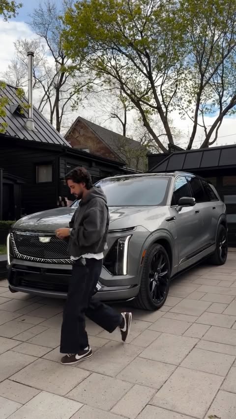 Instagram post by @com_lou for Cadillac. Caption reads: Iced out as Drizzy 🧊🫠 @cadillaccanada....
