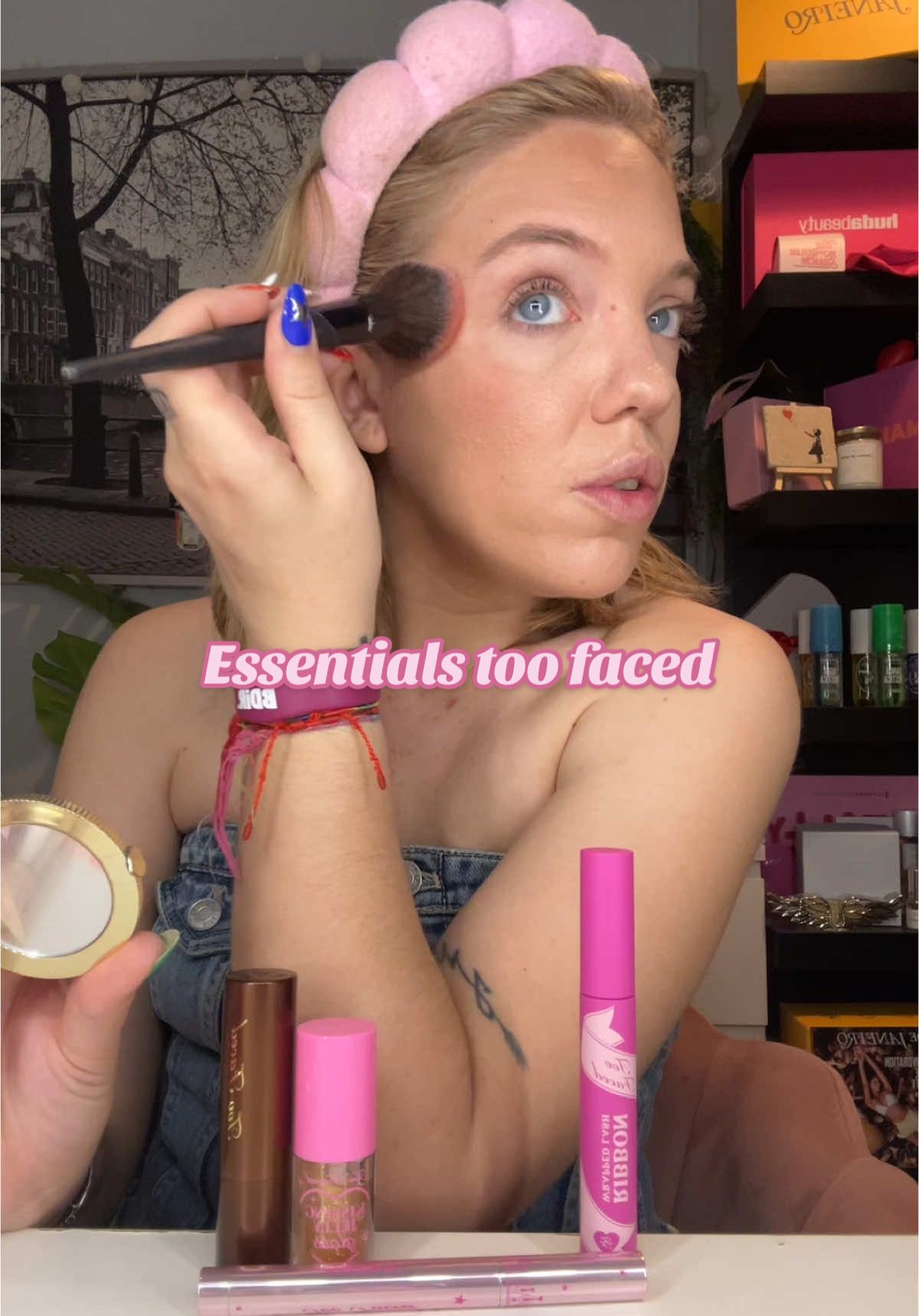 TikTok post by @claucasajuss for Too Faced. Caption reads: Los esenciales para este verano de @Too Faced....