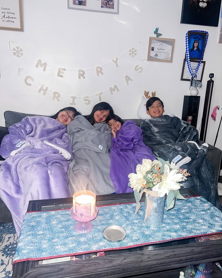 Instagram post by @princess.eva_ for Snuggie. Caption reads: [...] cuddle thru the Holidays with....