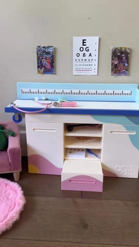 Instagram post by @defintiely for Our Generation Dolls. Caption reads: Setting up my mini clinic playset! 🩺🩻👩🏻‍⚕️....