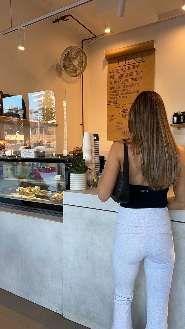 Instagram post by @mirandabrady for MyFitnessPal. Caption reads: Healthy but realistic day of food 🥯🥑🍓🌮 I focus....