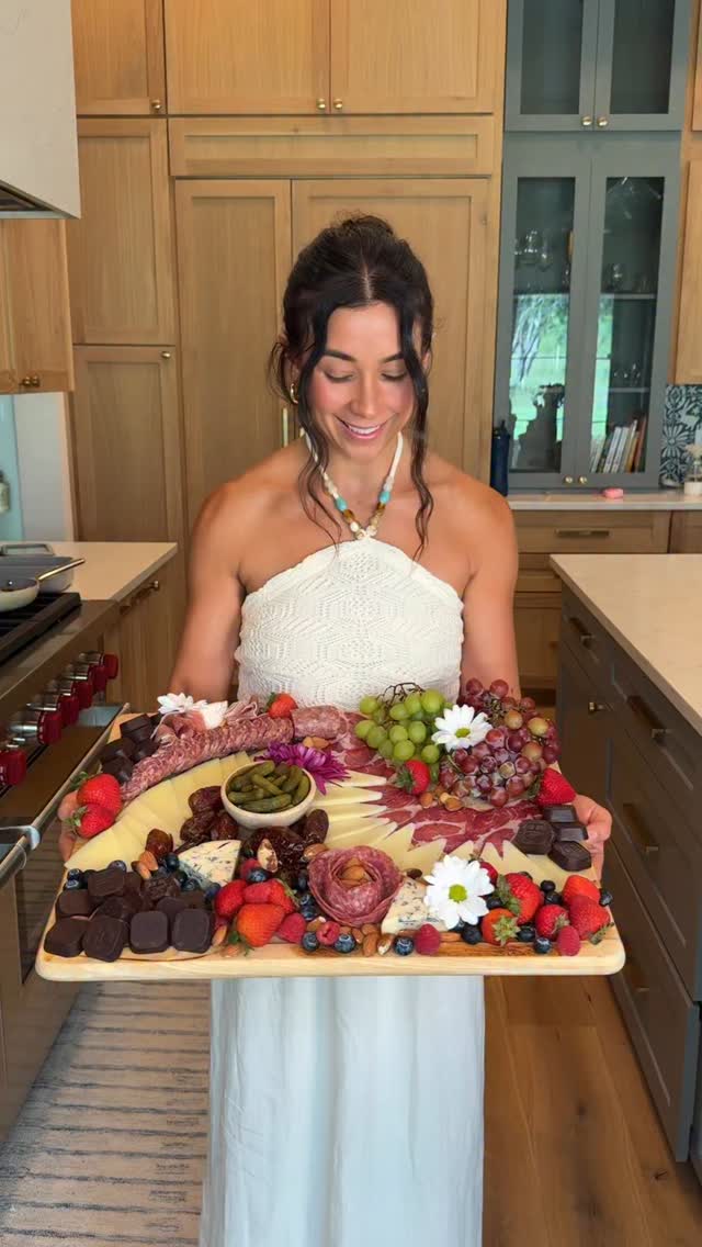 Instagram post by @yovana for Hu Kitchen. Caption reads: Sweet & Savory CHARCUTERIE BOARD 🍫🧀SAVE this....