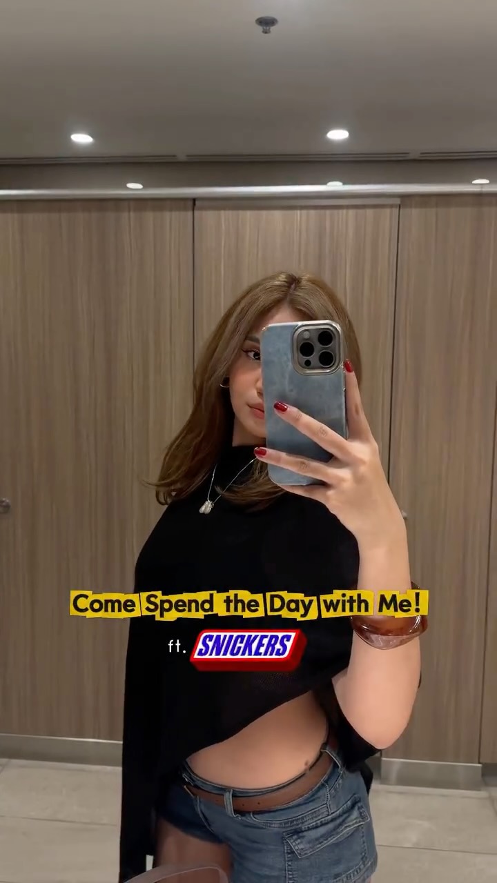 Instagram post by @melodyy_annee for Snickers. Caption reads: good thing I always have my mini on-the go snack!....