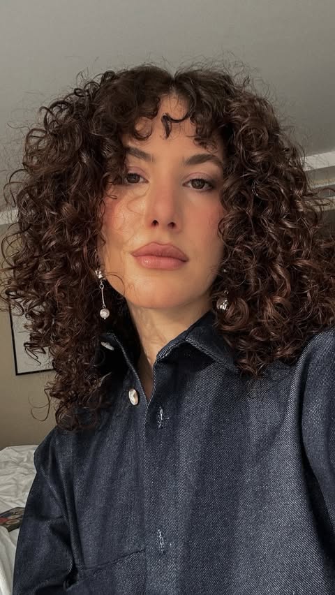 Instagram post by @itsjamiepaige for Oribe. Caption reads: The @oribe Eternal Curls Collection always gives....