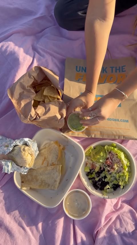 Instagram post by @bellamolony for QDOBA. Caption reads: #QDOBAPartner Let’s take our QDOBA on a beach....