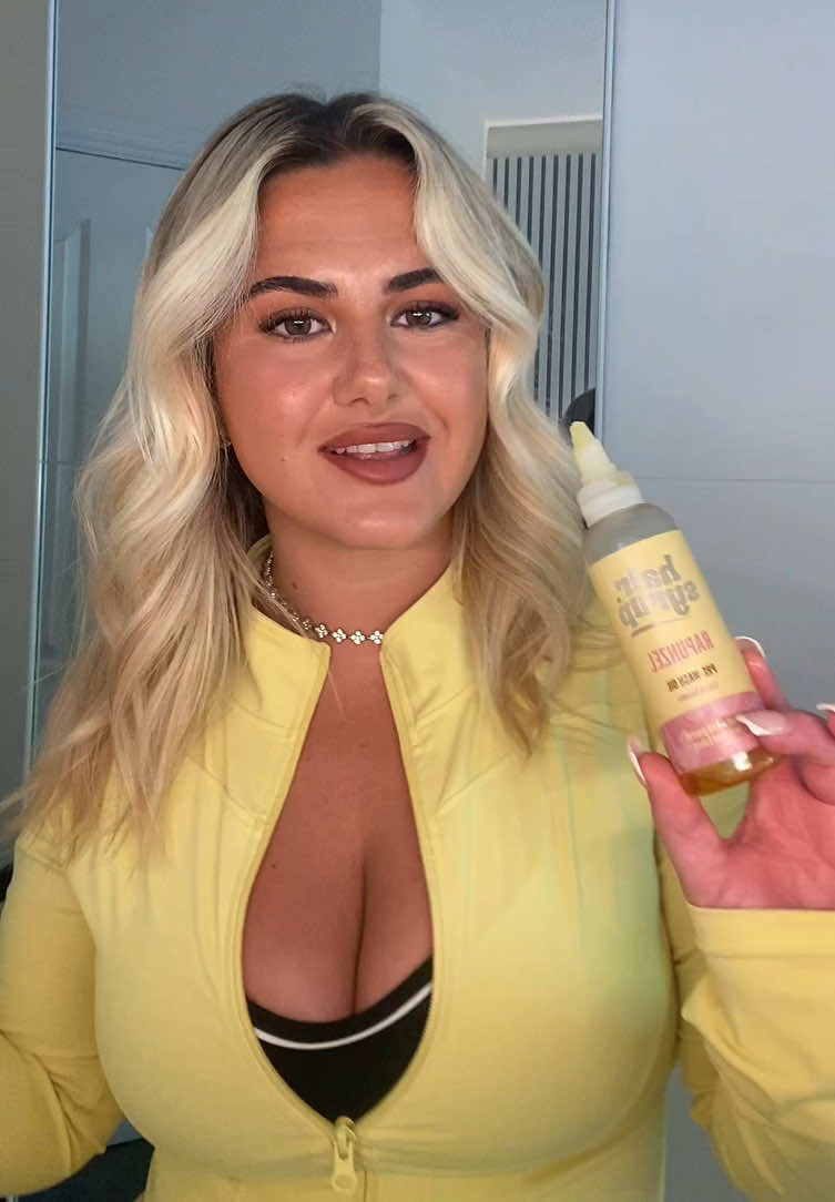 TikTok post by @aleshaaamarie for Hair Syrup. Caption reads: [...] hair? ✨ I’ve been using Rapunzel Hair Syrup....
