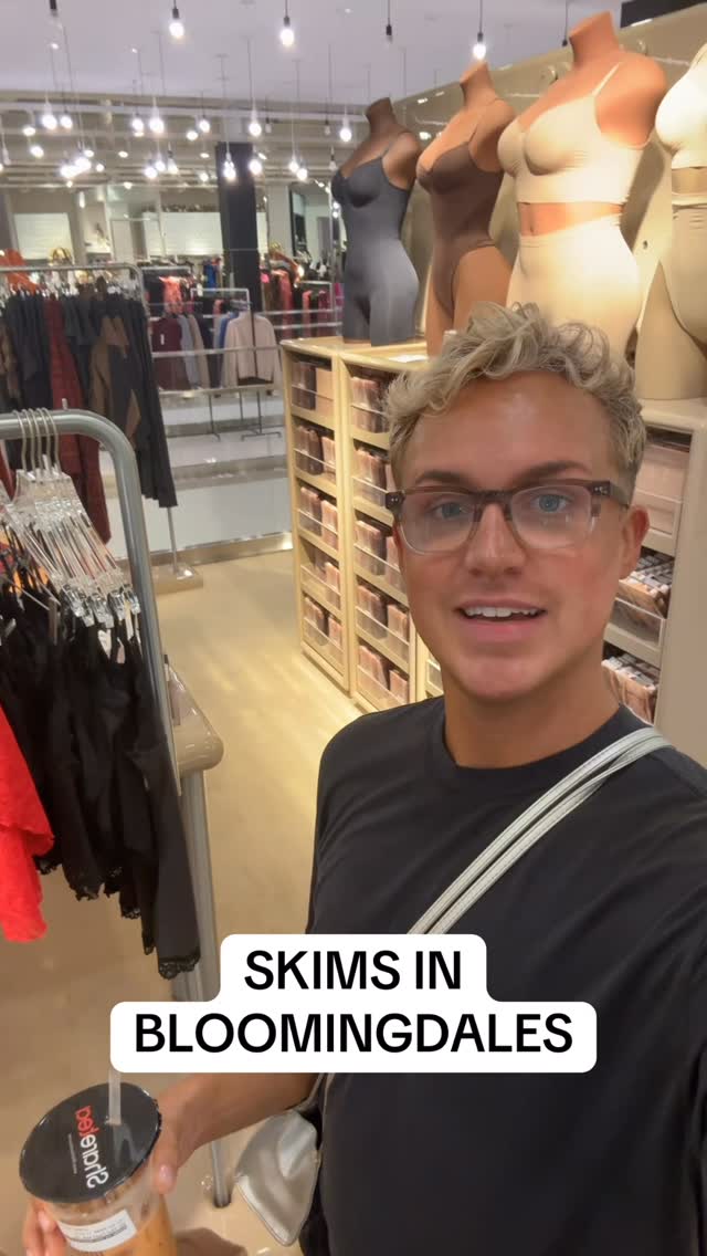 Instagram post by @gaymanwithaspraytan for Bloomingdale's. Caption reads: #skims #kimkardashian #bloomingdales #goodamerican....
