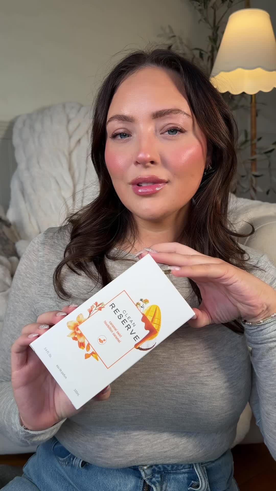TikTok post by @hollirobi for Clean Beauty. Caption reads: Reviewing the new perfume release Caramel Swirl....