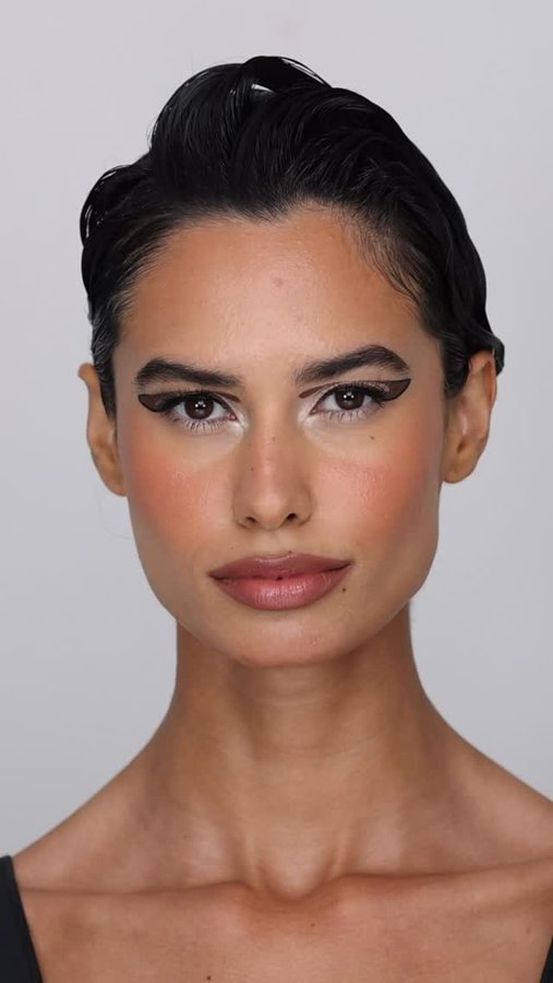 Instagram post by @voguearabia for Vogue Japan. Caption reads: Leading makeup artist @hindash recreates one of....