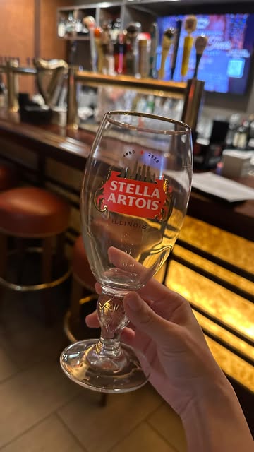 Instagram post by @natalieminalee for Stella Artois. Caption reads: Finally got my hands on my @stellaartoisusa state....