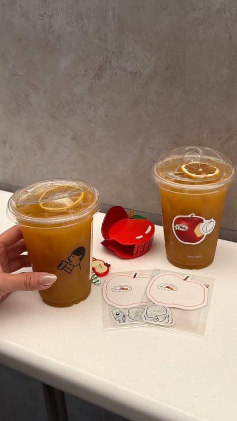Instagram post by @hillxlee for HEYTEA. Caption reads: apple lovers, this one’s for you!! 🍎 heytea's new....