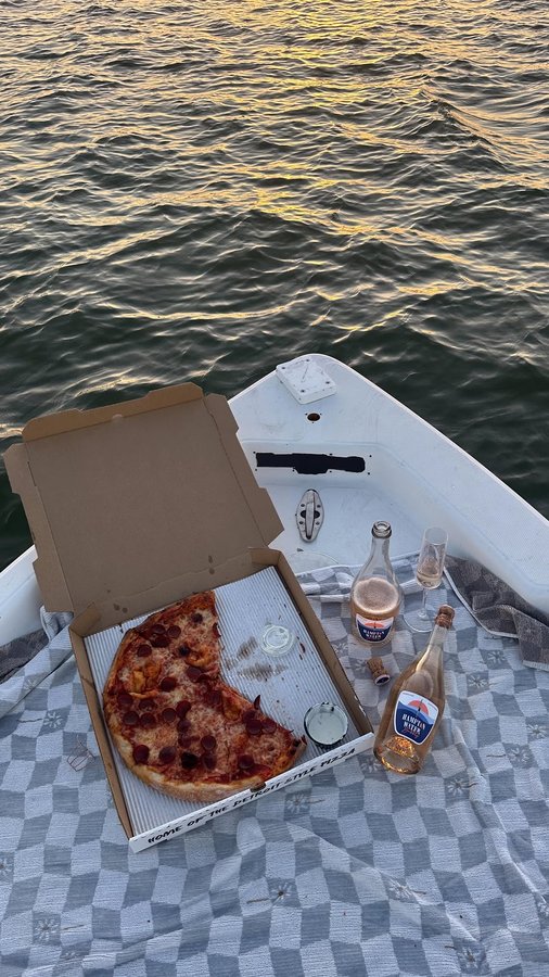 Instagram post by @kaitcassity for Hampton Water Wine. Caption reads: my favorite date nights: sunset + pizza +....