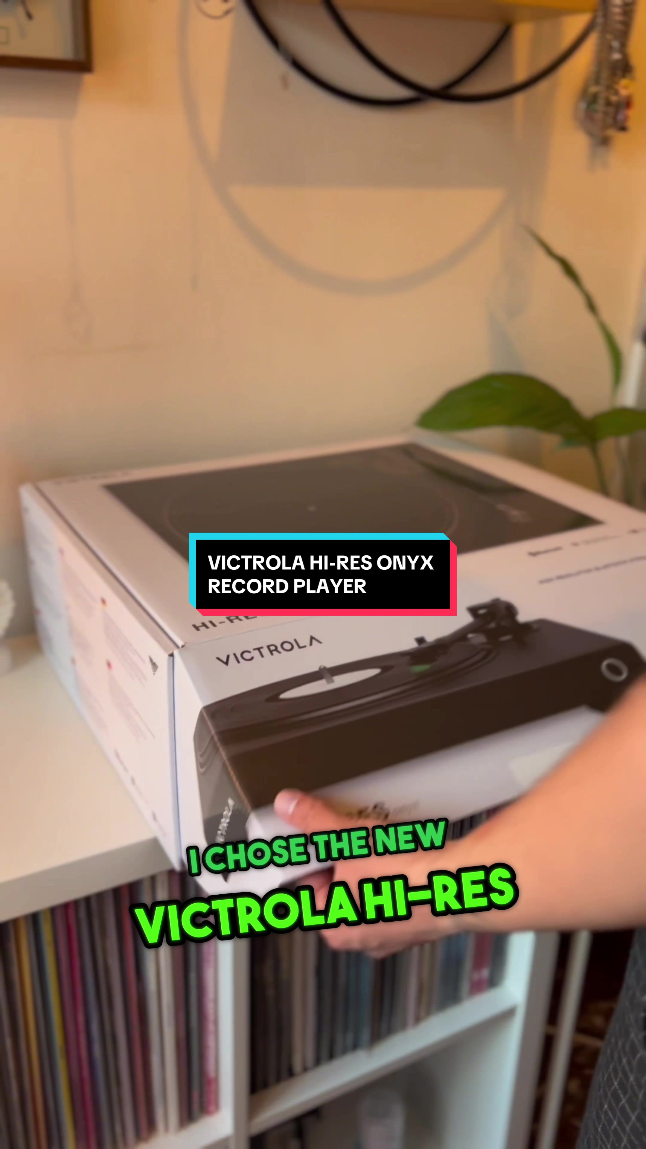 TikTok post by @erosversace for Victrola. Caption reads: I’M OBSESSED WITH MY NEW VICTROLA RECORD PLAYER....