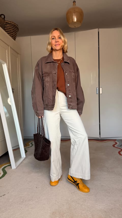 Instagram post by @ashley.dainty for WAT THE BRAND. Caption reads: [...] Outfit 2- Brown jeans @watthebrand * Cream....