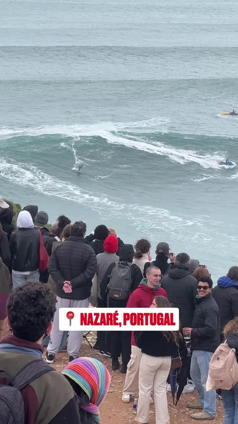 Instagram post by @rafaeltapialewin for World Surf League. Caption reads: POV: you're on the cliff watching Nazaré doing its....
