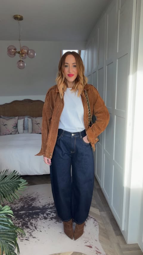 Instagram post by @katiemaxwellstylist for WAT THE BRAND. Caption reads: [...] rain? 😭😭 We got this! 💪🏼 Jeans....