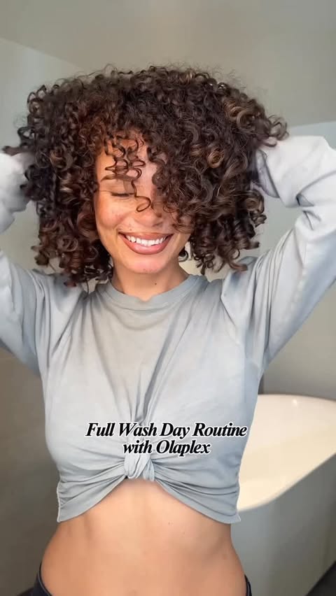 Instagram post by @joyjah for OLAPLEX. Caption reads: It’s giving healthy hair. 
Wash day with @olaplex....