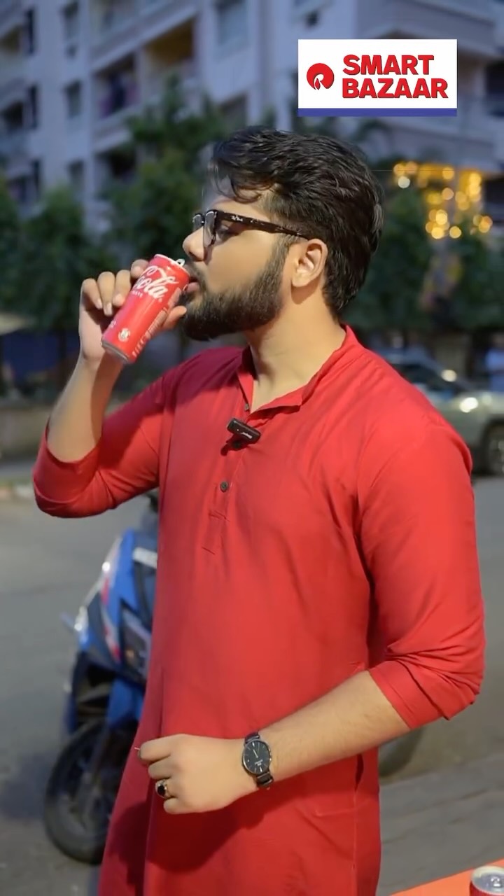 Instagram post by @sreyaskam_ghoshal for SMART Bazaar. Caption reads: Smart Bazaar e naki pawa jacche FREE Coca-Cola!....