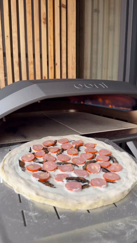 Instagram post by @7thfloorpizza for Ooni. Caption reads: High heat. Short bake. 90 seconds in the Ooni Koda....