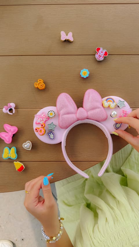Instagram post by @emilynels8 for Disney. Caption reads: customizing the NEW Crocs x Disney Minnie Ears....