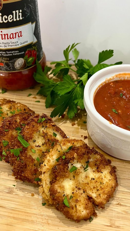 Instagram post by @homecookingwithnaj for Botticelli Foods. Caption reads: 💫Halloumi Chips & Botticelli Marinara Sauce-....