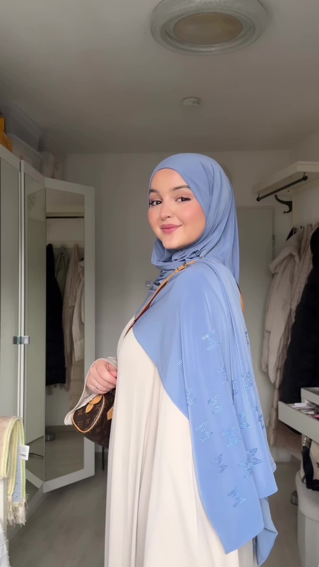 TikTok post by @ayouyaa19 for Merrachi. Caption reads: Obsessed with the color 🦋@MERRACHI #fyp #hijab....