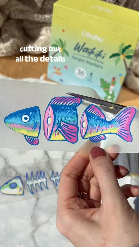 Instagram post by @ek_graphic_ for Ohuhu Art Supplies. Caption reads: DIY Fish Earrings🐟💫 Created these using shrink....