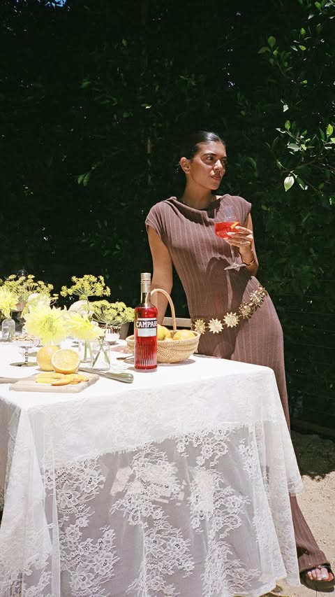Instagram post by @catchmeeksifyoucan for Campari. Caption reads: [...] my backyard with a summer aperitivo and....